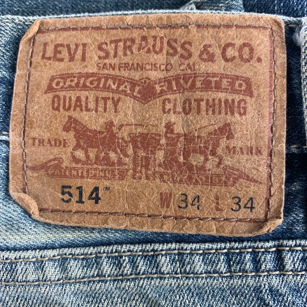 Levis 514.  Perfectly faded and softened to perfection.  Soft blue and shredded